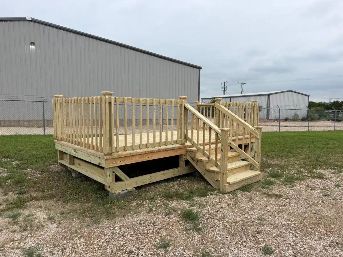Pressure-treated pine deck with railing and side stairs